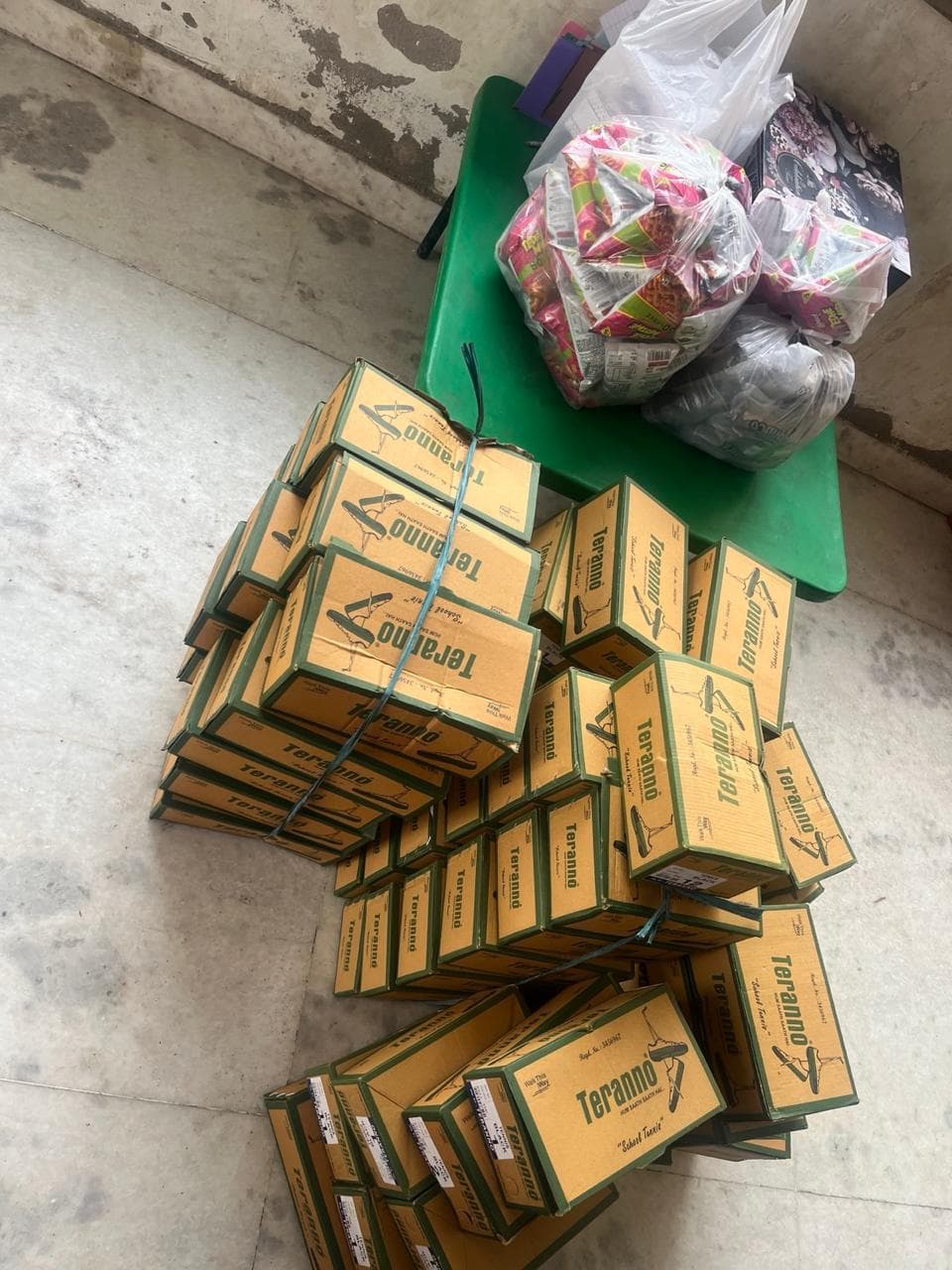 Children receiving shoes distributed by the Navkalp Foundation