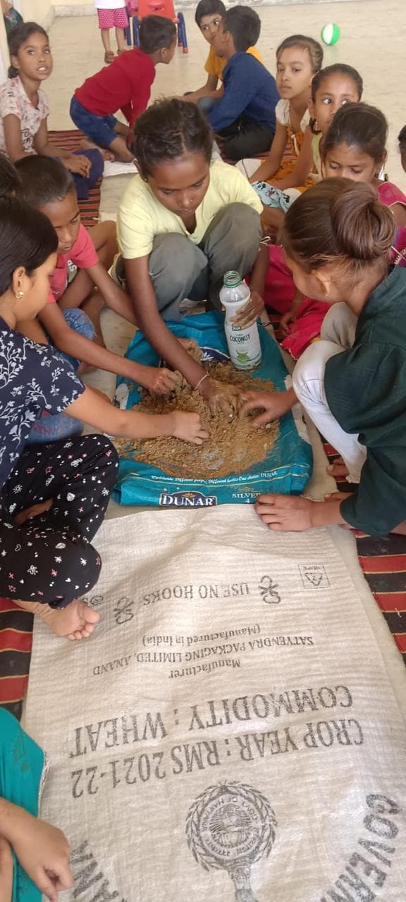 Children planting seeds during an Earth Day activity